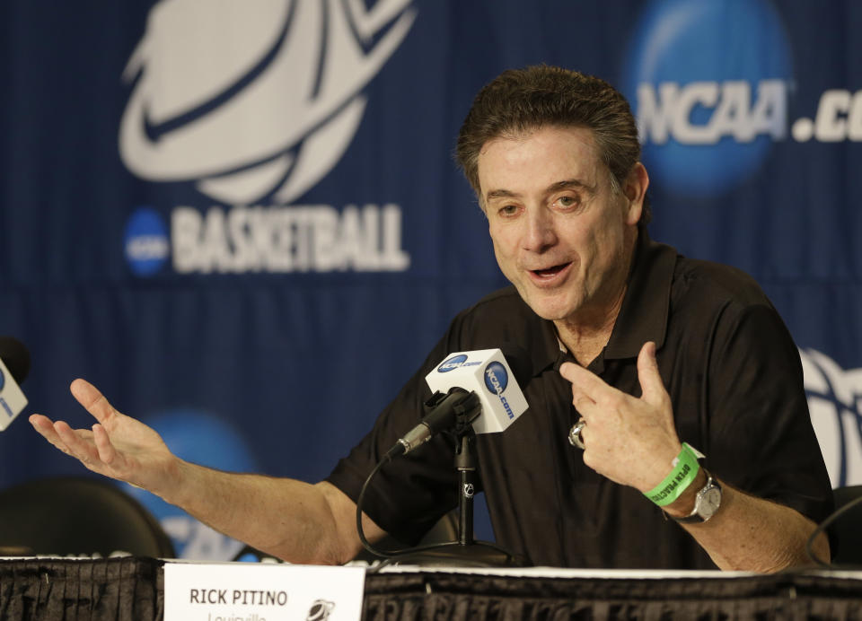 Louisville head coach Rick Pittino answers questions at a news conference for the NCAA college basketball tournament in Orlando, Fla., Wednesday, March 19, 2014. Manhattan plays against Louisville in a second round game on Thursday. (AP Photo/John Raoux)