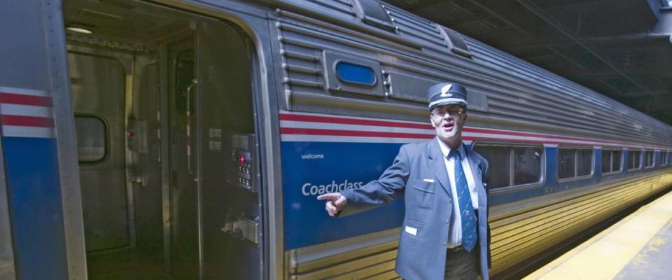 Conductor at Amtrak train platform announces 