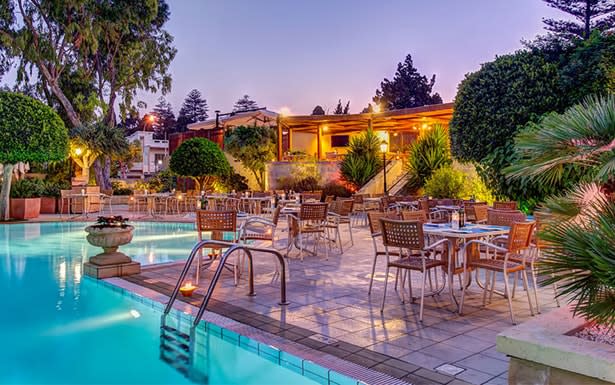 The Corinthia Palace's tranquil garden has a large pool-deck around a split-level swimming pool that echoes the shape of Malta’s Neolithic Hagar Qim temple.