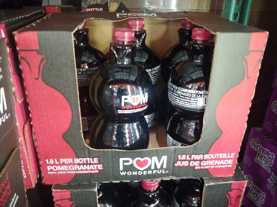 bottles of pom pomegranate juice in boxes at costco