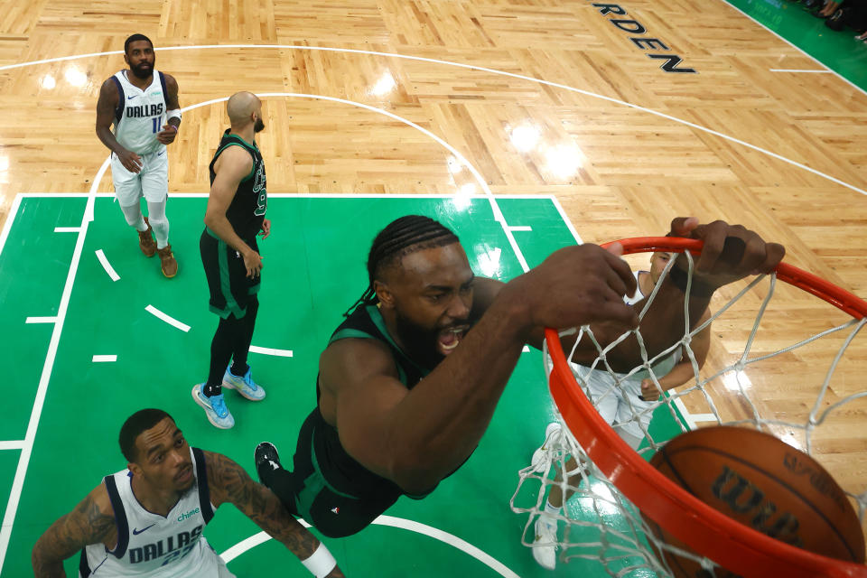 BOSTON, MASSACHUSETTS - JUNE 09: Jaylen Brown #7 of the Boston Celtics dunks the ball over P.J. Washington #25 of the Dallas Mavericks during the second half in Game Two of the 2024 NBA Finals at TD Garden on June 09, 2024 in Boston, Massachusetts. NOTE TO USER: User expressly acknowledges and agrees that, by downloading and or using this photograph, User is consenting to the terms and conditions of the Getty Images License Agreement. (Photo by Maddie Meyer/Getty Images)