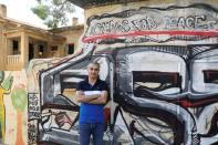 Omid Tootian, an Iranian musician, poses for a picture in the UN buffer zone at Ledra Palace in Nicosia