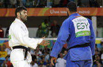 <p>Where politics meet the Olympic Games, the Olympic spirit is lost. This was the case when Egyptian judoka Islam El Shehaby refused to shake hands following his defeat with his Israeli opponent Or Sasson. Despite this demonstration of poor sportsmanship to the world, this is a big "no-no" in judo, where respect is a big part of the sport. (AP Photo/Markus Schreiber) </p>