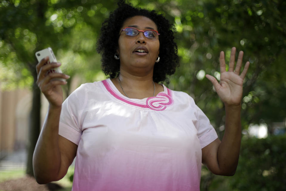 This photo taken Aug. 11, 2013 shows Kimberly C. Ellis talking about Black Twitter at Freedom Corner in the Hill District of Pittsburgh. Black Twitter is a small but growing corner of the social media giant where an unabashedly black spin on life gets served up 140 characters at a time. Black Twitter holds court on pretty much everything from President Barack Obama to the latest TV reality show antics. But don't get it twisted. Black Twitter can turn activist quickly. (AP Photo/Gene J. Puskar)