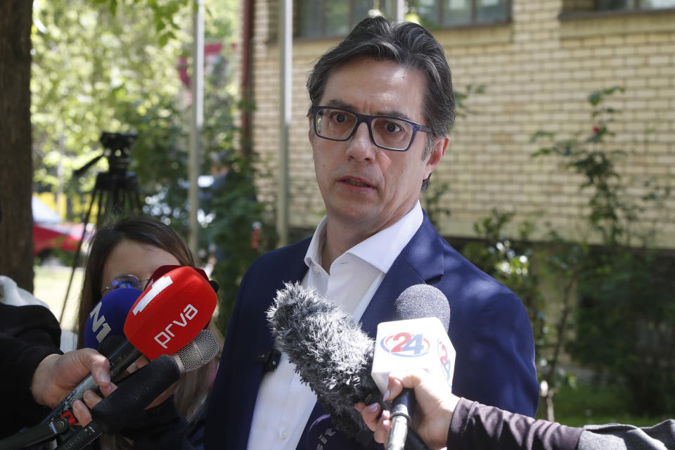 Stevo Pendarovski, incumbent President and a presidential candidate backed by the ruling social democrats (SDSM), talks to media outside a polling station after voting in the presidential election in Skopje, North Macedonia, on Wednesday, April 24, 2024. People are lining up at pools to cast their votes in a peaceful atmosphere, hoping that the next president will be able to bring the country into the European Union. (AP Photo/Boris Grdanoski)