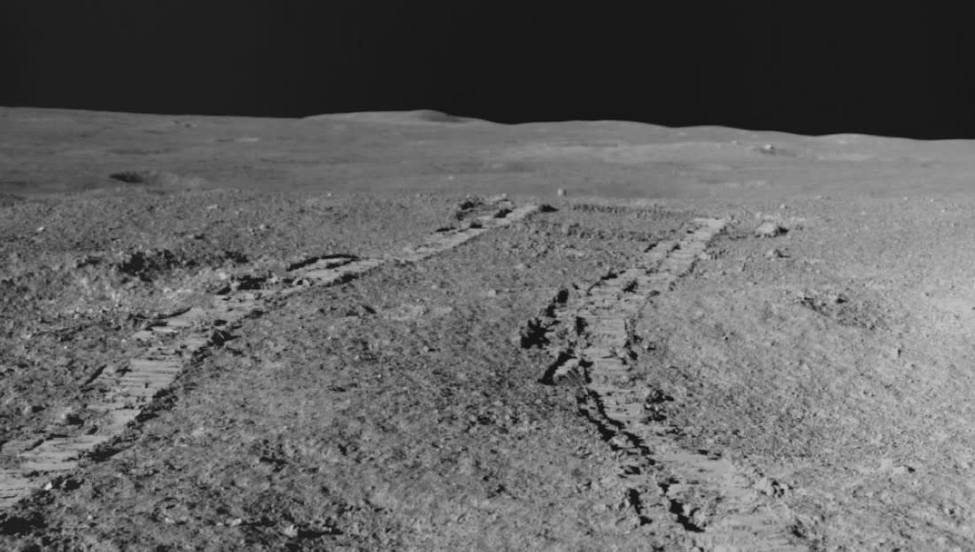  Tracks from India's lunar rover appear on the grey, dusty surface of the moon's south pole 