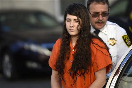 Miranda Barbour, 19, the woman dubbed the so-called Craigslist killer suspect, is led into court by sheriff deputies in Sudbury, Pennsylvania April 1, 2014. REUTERS/Mark Makela