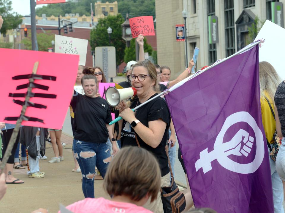 Kristine Fowler-Geis talks during a protest against the U.S. Supreme Court's overturn of Roe vs. Wade on Wednesday in front of the Muskingum County Courthouse in downtown Zanesville. An event posting through social media website Facebook attracted dozens of activists.