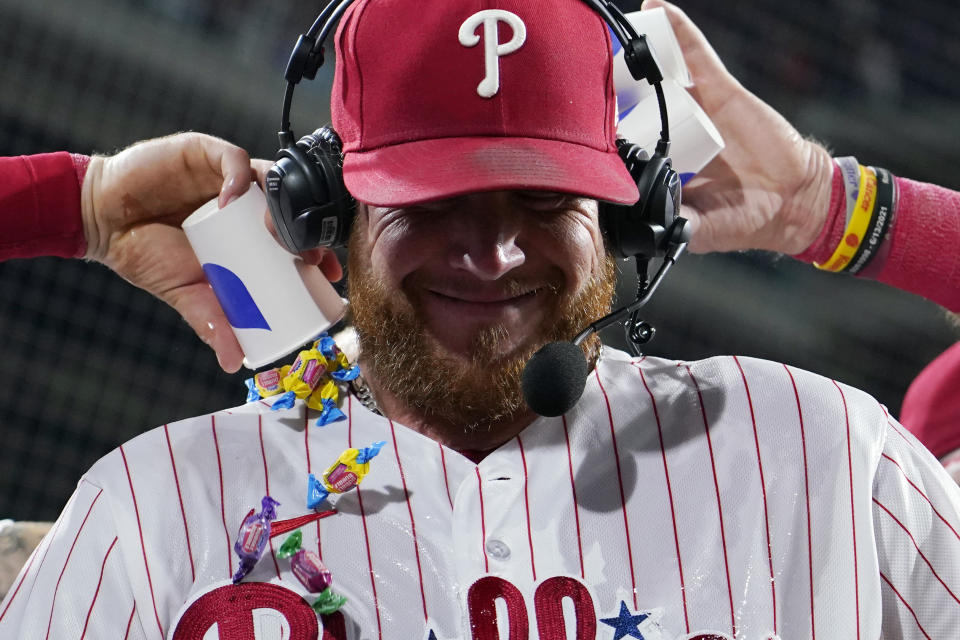 Philadelphia Phillies' Craig Kimbrel is doused with water and candy after the Phillies won a baseball game against the Milwaukee Brewers, Tuesday, July 18, 2023, in Philadelphia. (AP Photo/Matt Slocum)