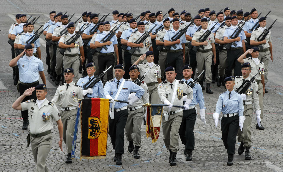 German soldiers march on the Champs-Elysees avenue during the Bastille Day parade in Paris, France, Sunday July 14, 2019. (AP Photo/Michel Euler)