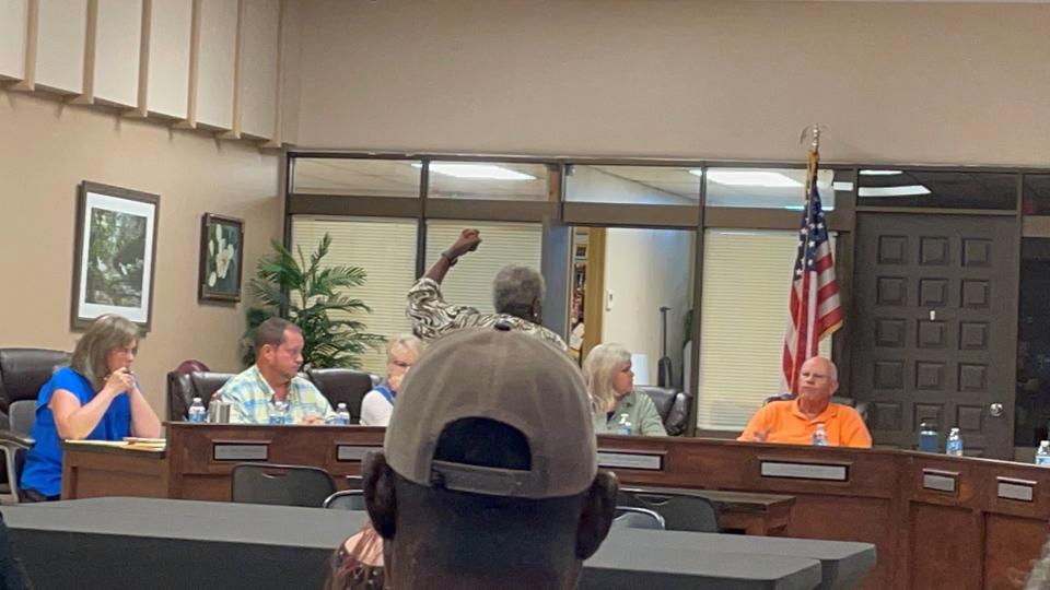 Sumrall, Miss., resident Arthrine Collins, 75, tells Ward 1 Alderman Lamar Reed, right, his Facebook post was offensive and racist. Reed said the meme he shared on social media was "self-deprecating humor." The aldermen held a special-called meeting Thursday, Aug. 18, 2022, to discuss in executive session what disciplinary action should be given to a police officer accused of making a post on social media that allegedly violates Sumrall's social media policy.