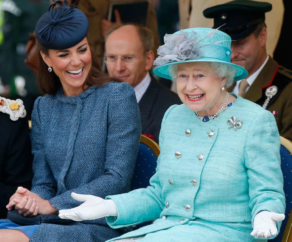 Kate Middleton and Queen Elizabeth II adorn in dark and light blue dresses and hats to match with a lovely smile on their faces