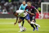 FILE - United States' Kellyn Acosta (23) and Mexico's Hector Herrera compete for the ball during a qualifying soccer match for the FIFA World Cup Qatar 2022 at Azteca stadium in Mexico City, Thursday, March 24, 2022. (AP Photo/Eduardo Verdugo, File)