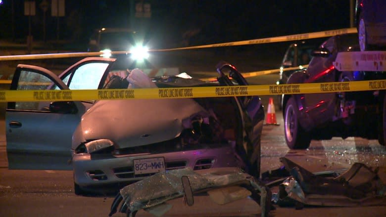 New Westminster crash traps woman in car