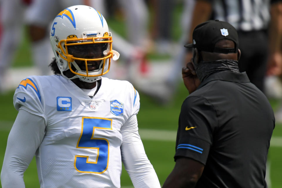 Quarterback Tyrod Taylor #5 of the Los Angeles Chargers and Head coach Anthony Lynn of the Los Angeles Chargers talk before playing against the Kansas City Chiefs at SoFi Stadium on September 20, 2020 in Inglewood, California. (Photo by Harry How/Getty Images)