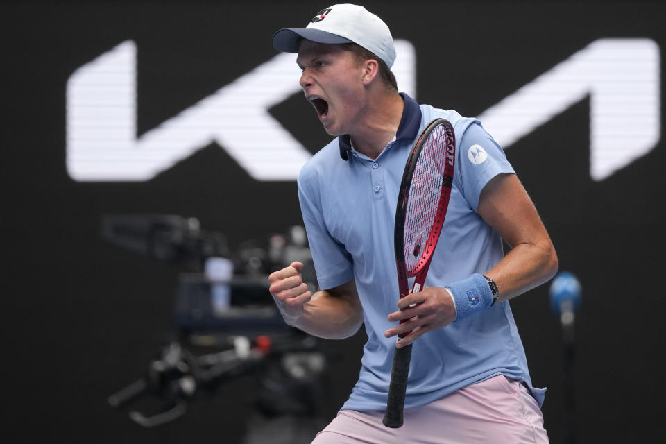 Jenson Brooksby of the U.S. reacts after winning the first set against Casper Ruud of Norway in their second round match at the Australian Open tennis championship in Melbourne, Australia, Thursday, Jan. 19, 2023. (AP Photo/Dita Alangkara)