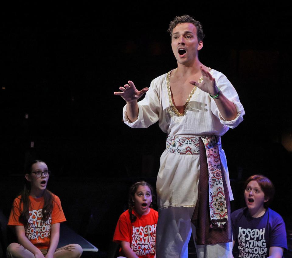 Joseph (TJ Wessel) sings "Any Dream Will Do" with the Children's Choir in Beef & Board Dinner Theatre's production of "Joseph and the Amazing Technicolor Dreamcoat," on stage through Nov. 19. Tickets include Chef Larry Stoops' buffet and select beverages.