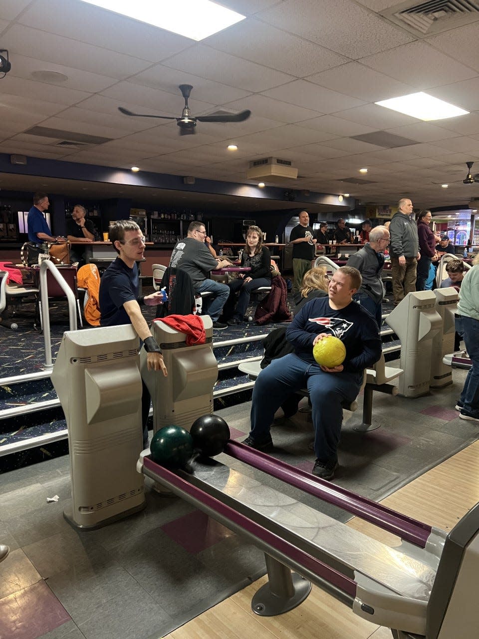 Bowlers Joshua Shlagor and Harry Sharp (sitting) are shown at the recent Monroe County Special Olympics Area 34 Bowling Tournament at Monroe Sports Center.