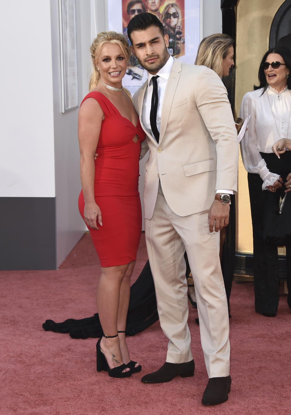 Britney Spears and Sam Asghari arrive at the Los Angeles premiere of "Once Upon a Time in Hollywood," at the TCL Chinese Theatre, Monday, July 22, 2019. Spears announced on Instagram on Sunday, Sept. 12, 2021, that she and Asghari are engaged. The couple met on the set of her “Slumber Party” music video in 2016. (Photo by Jordan Strauss/Invision/AP, File)