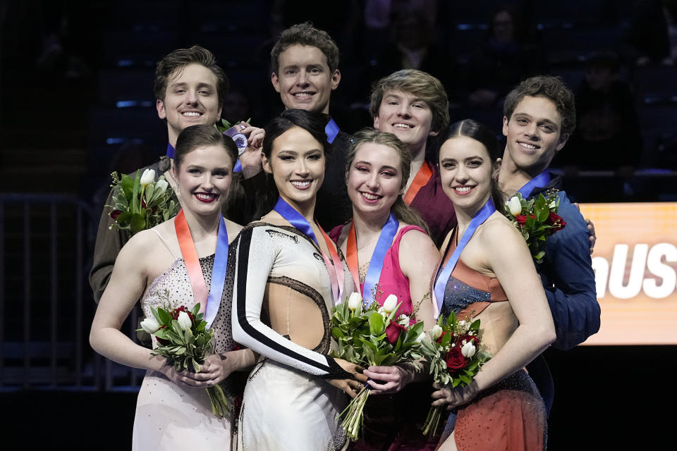 From left, silver medalists Christina Carreira and Anthony Ponomarenko, gold medalists Madison Chock and Evan Bates, bronze medalists Emily Bratti and lan Somerville, and pewter medalists Caroline Green and Michael Parsons participate in a medal ceremony for championship ice dance at the U.S. figure skating championships Saturday, Jan. 27, 2024, in Columbus, Ohio. (AP Photo/Sue Ogrocki)