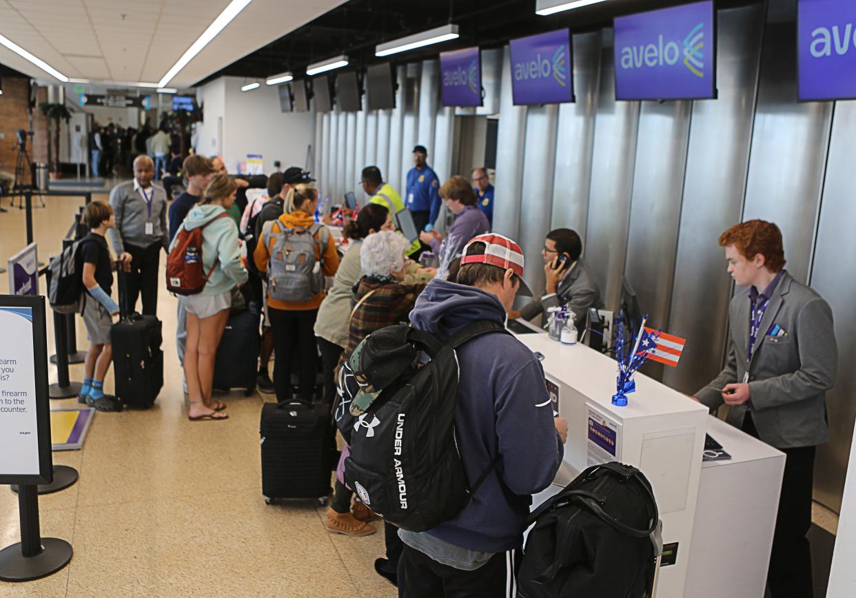 Passengers at the check-in counter for Avelo Airlines first flight from Wilmington to San Juan Puerto Rico on Wednesday, November 15, 2023.