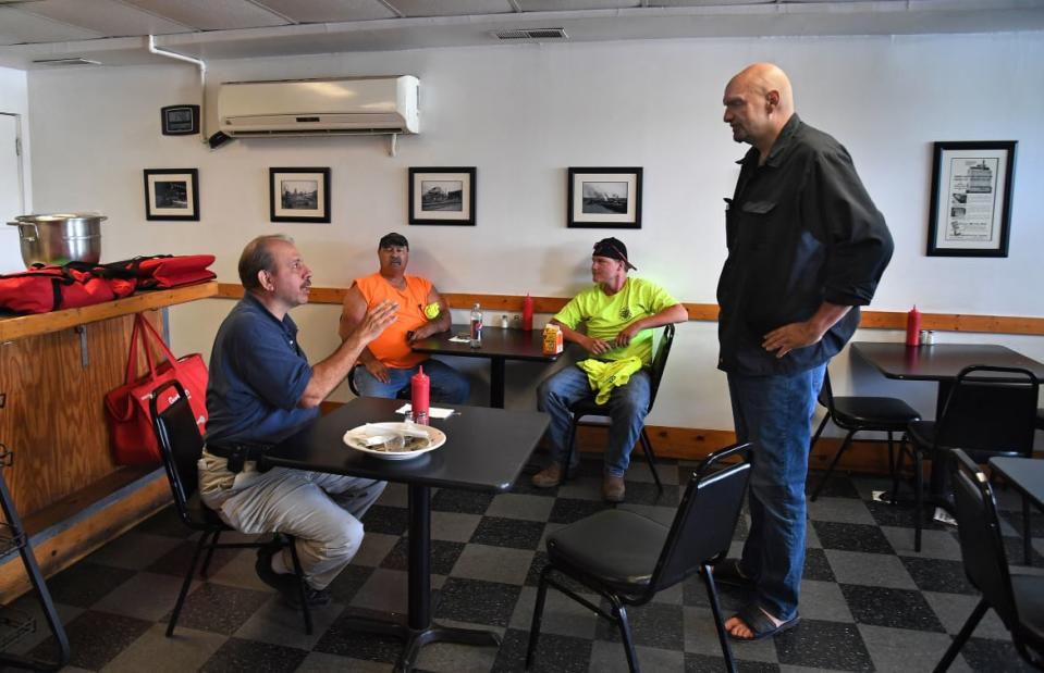 <div class="inline-image__caption"><p>John Fetterman talking with locals in Clairton, Pennsylvania. </p></div> <div class="inline-image__credit">Michael S. Williamson/The Washington Post via Getty Images</div>