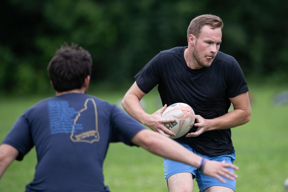 Worcester Rugby Club's David MacLeod looks to pass during practice drills on Wednesday.