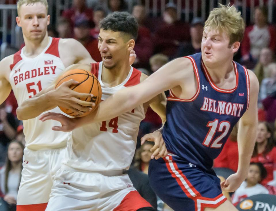 Bradley's Malevy Leons (14) tangles with Belmont's Drew Friberg in the second half Saturday, Jan. 21, 2023 at Carver Arena. The Braves fell to the Bruins 78-76.