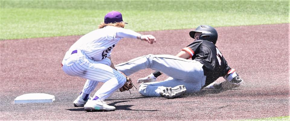 Aledo's Ryan Jones, right, slides into second as Wylie shortstop J.T. Thompson tries to make the tag. Jones was called safe on the two-out double in the second inning.