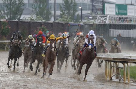 May 5, 2018; Louisville, KY, USA; Mike Smith aboard Justify (7) leads the field during the 144th running of the Kentucky Derby at Churchill Downs. Mandatory Credit: Brian Spurlock-USA TODAY Sports