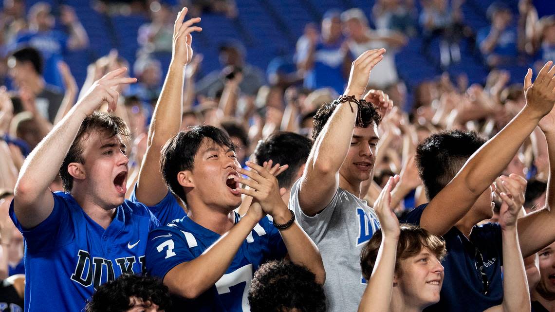 Fans in the student section cheer during the first half of the Blue Devilsí season opener against Temple at Wallace Wade Stadium on Friday, Sept. 2, 2022, in Durham, N.C.