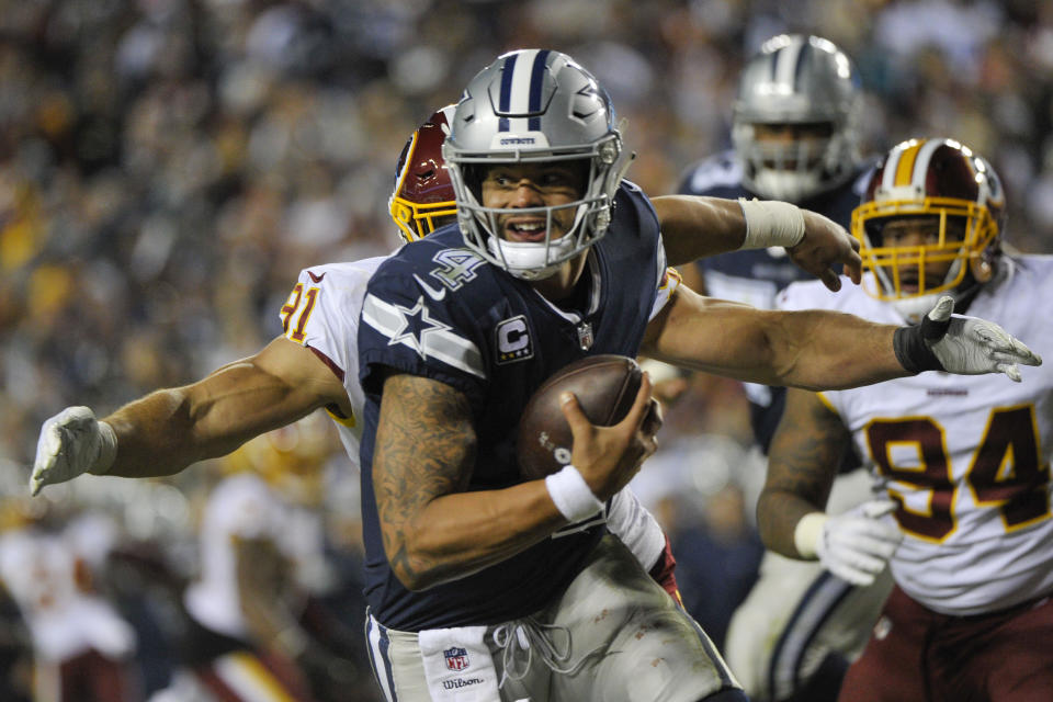 Washington linebacker Ryan Kerrigan (91) closes in on Dallas quarterback Dak Prescott (4) during the first meeting between the teams this season. (AP)