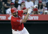 Los Angeles Angels' Albert Pujols drives in three runs with a double during the first inning of a baseball game against the Houston Astros on Tuesday, July 16, 2019, in Anaheim, Calif. (AP Photo/Marcio Jose Sanchez)