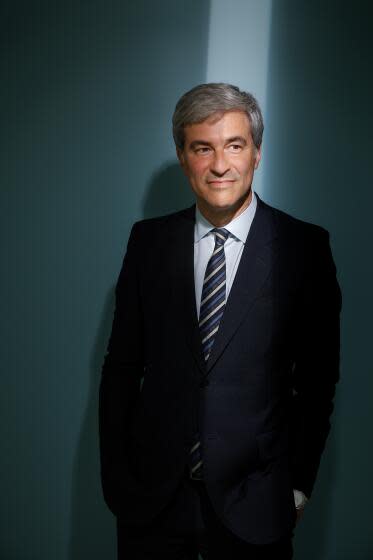 A man is photographed in the Los Angeles Times photo studio