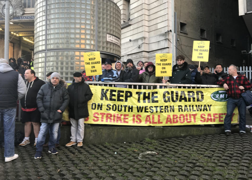 BEST QUALITY AVAILABLE People protesting outside Waterloo station, as hundreds of thousands of rail passengers faced travel misery on Monday at the start of a series of strikes in the long-running dispute over guards on trains.