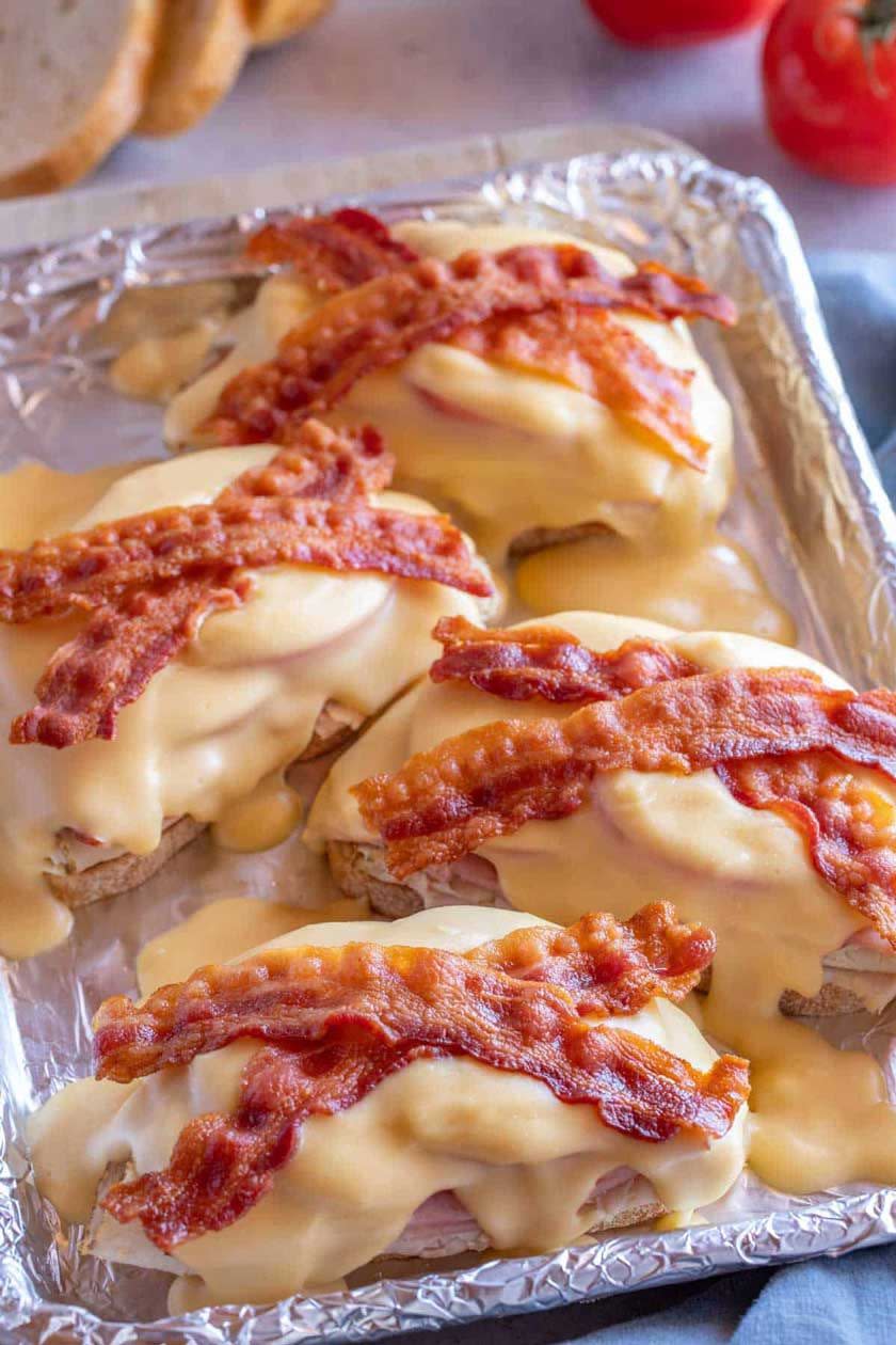 <p><strong>Hot Brown</strong></p><p>Local to Louisville, this sandwich was created at the infamous <a href="https://www.brownhotel.com/?gclid=CjwKCAjw_Y_8BRBiEiwA5MCBJluPtt61QAPjffNnWySLxncMazpVDPPHiWrmDJhff5RqcRlkl6aYJhoCzhoQAvD_BwE&gclsrc=aw.ds" rel="nofollow noopener" target="_blank" data-ylk="slk:Brown Hotel;elm:context_link;itc:0;sec:content-canvas" class="link ">Brown Hotel</a> in the 1920s. Welsh rarebit with some extra heft, this open-faced sandwich consisting of turkey, bacon and cheese sauce is broiled and always served hot. Nowadays it’s sometimes served with toast to add some crunch.</p>