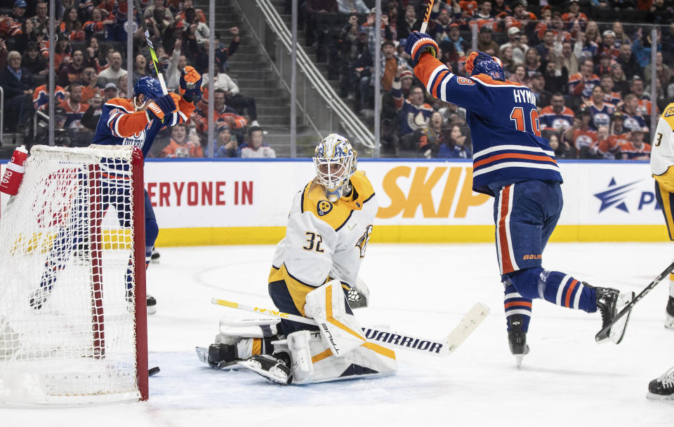 Nashville Predators goalie Kevin Lankinen (32) is scored on as Edmonton Oilers' Zach Hyman (18) celebrates during the second period of an NHL hockey game in Edmonton on Saturday Nov. 4, 2023. (Jason Franson/The Canadian Press via AP)