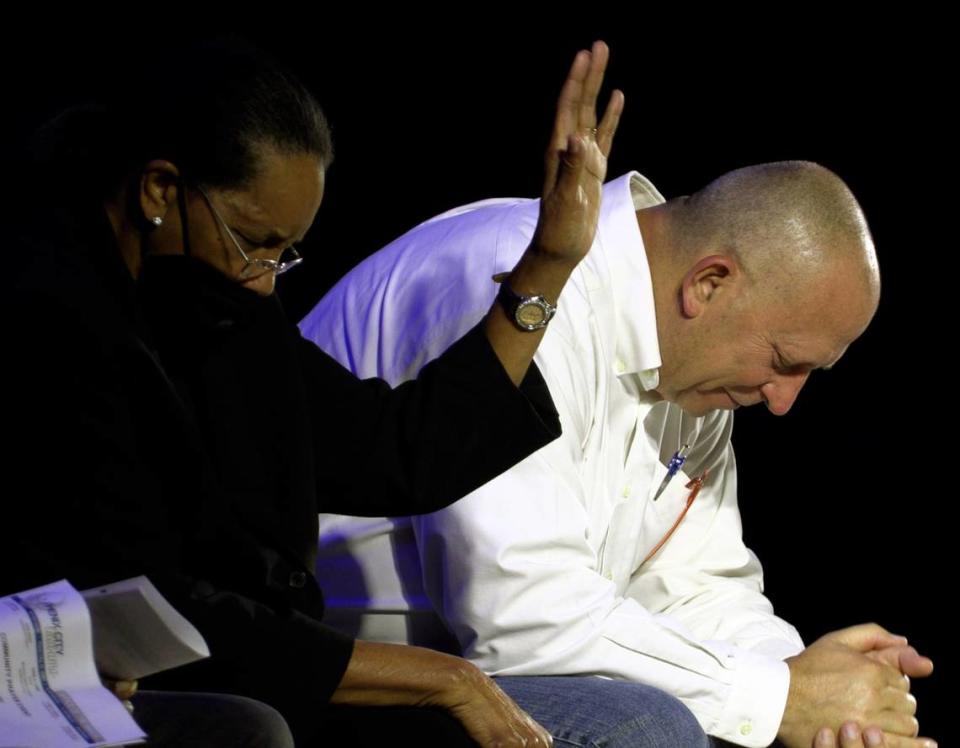 Annie Lewis, pastor of the We Can Ministry, left, and Pastor Lynn McManious of Beaver Creek Baptist Church join in prayer at a community prayer event Tuesday night at the Phenix City Amphitheater in Phenix City, Alabama. 11/08/2023