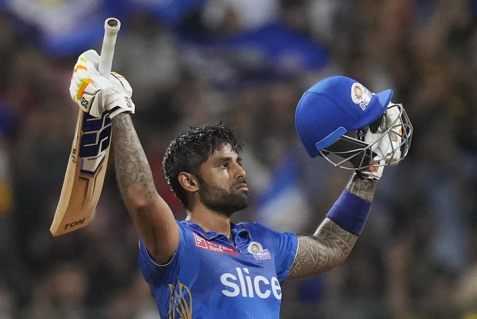 Mumbai Indians' Suryakumar Yadav celebrates his century during the Indian Premier League cricket match between Mumbai Indians and Gujrat Titans in Mumbai, India, Friday, May 12, 2023. (AP Photo /Rajanish Kakade)