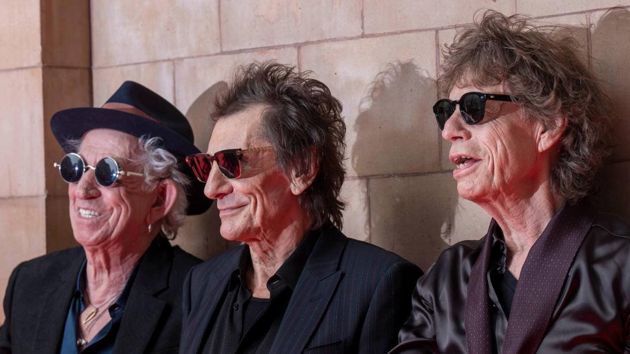  The Rolling Stones pose for pictures. 