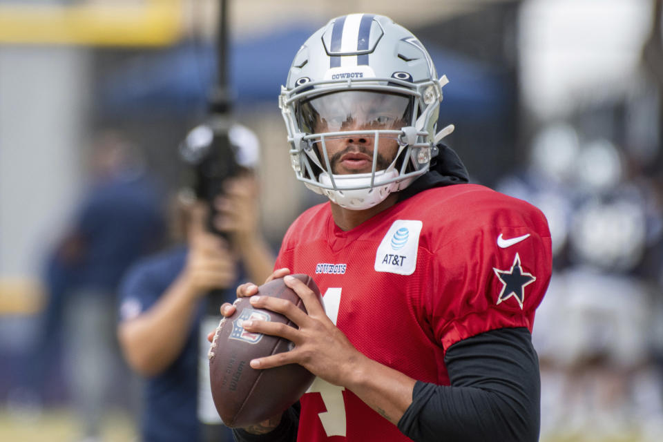 Dallas Cowboys quarterback Dak Prescott does a non-passing drill during practice at the NFL football team's training camp in Oxnard, Calif., Saturday, July 31, 2021. (AP Photo/Michael Owen Baker)