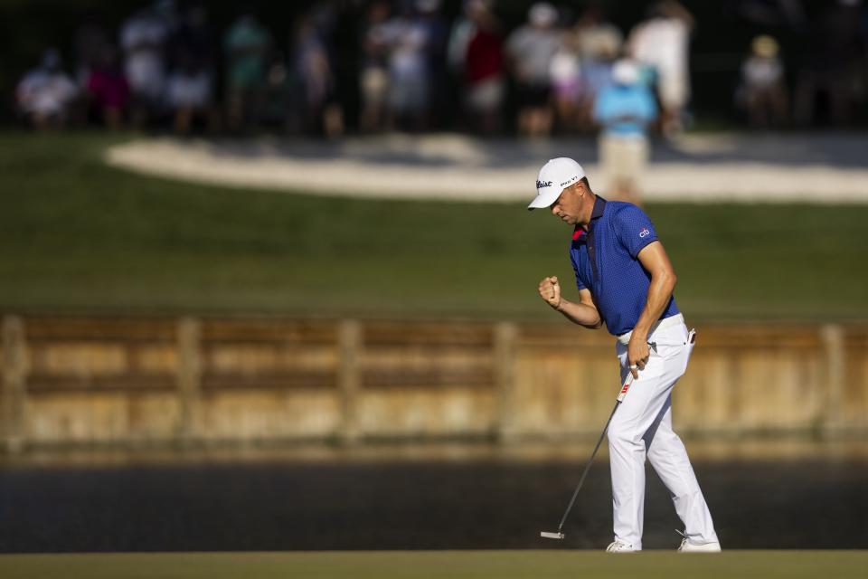 Justin Thomas reacts after sinking his putt on the 17th Green during the final round of THE PLAYERS Championship on THE PLAYERS Stadium Course at TPC Sawgrass on March 14, 2021 in Ponte Vedra Beach, Florida. (James Gilbert / Florida Times-Union)