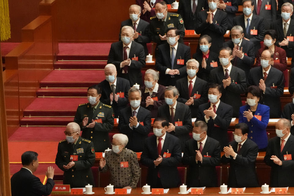 Chinese President Xi Jinping waves as he arrives at the opening ceremony of the 20th National Congress of China's ruling Communist Party held at the Great Hall of the People in Beijing, China, Sunday, Oct. 16, 2022. China on Sunday opens a twice-a-decade party conference at which leader Xi Jinping is expected to receive a third five-year term that breaks with recent precedent and establishes himself as arguably the most powerful Chinese politician since Mao Zedong. (AP Photo/Mark Schiefelbein)