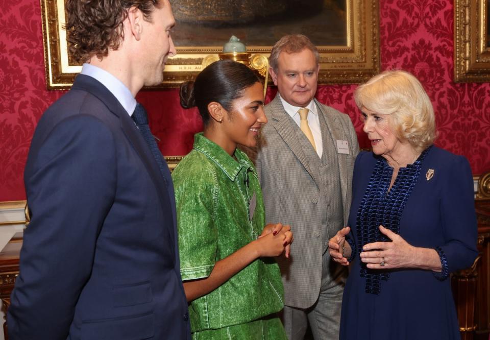 Queen Camilla speaks with Tom Hiddleston, Olivia Dean and Hugh Bonneville during a reception at Buckingham Palace (Chris Jackson/PA Wire)