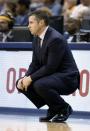 Memphis Grizzlies coach David Joerger watches the action in the first half of Game 3 of an opening-round NBA basketball playoff series against the Oklahoma City Thunder on Thursday, April 24, 2014, in Memphis, Tenn. (AP Photo/Mark Humphrey)