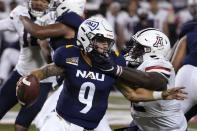 Arizona defensive lineman Kyon Barrs pressures Northern Arizona quarterback Jeff Widener (9) during the first half of an NCAA college football game, Saturday, Sept. 18, 2021, in Tucson, Ariz. (AP Photo/Rick Scuteri)