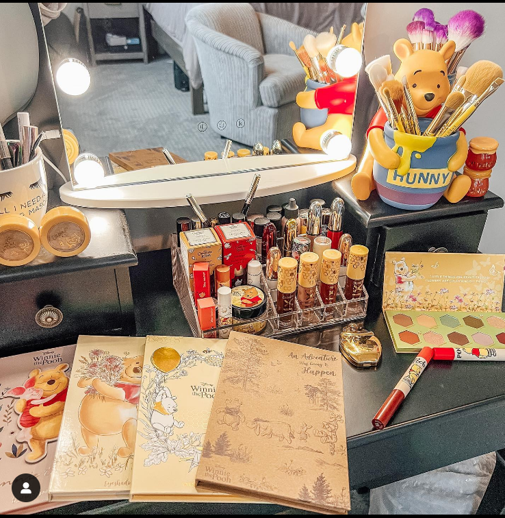 Books and makeup items on a table