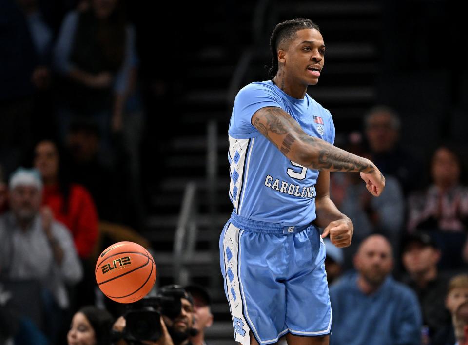 North Carolina's Armando Bacot reacts after a dunk against Michigan during the first half on Wednesday, Dec. 21, 2022, in Charlotte, North Carolina.