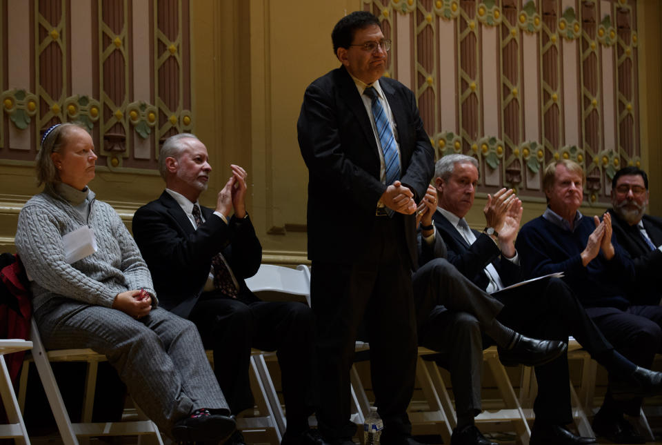 Lay cantor Cheryl Klein of Dor Hadash (left), Rabbi Jeffrey Myers of Tree of Life and Rabbi Jonathan Perlman of New Light Congregation are honored during an Oct. 28 memorial service in Pittsburgh. (Photo: Jeff Swensen via Getty Images)