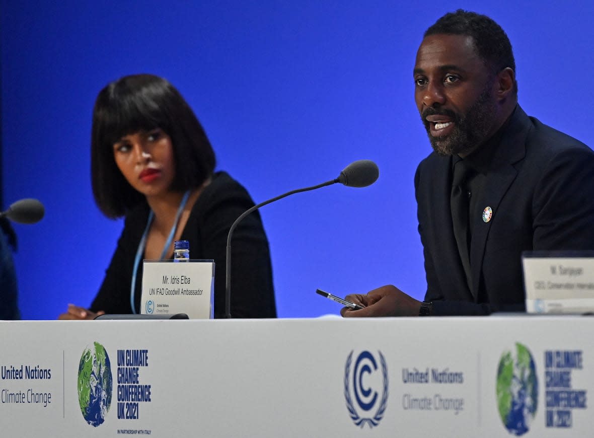 International Fund for Agricultural Development (IFAD) Goodwill Ambassadors English actor Idris Elba (R) and his Canadian actress and activist wife, Sabrina Elba, take part in a session at the COP26 UN Climate Summit in Glasgow on November 6, 2021. (Photo by Paul ELLIS / AFP) (Photo by PAUL ELLIS/AFP via Getty Images)